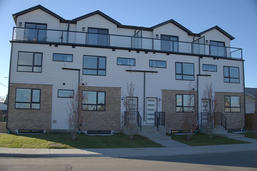 Brick front townhomes with roof patios