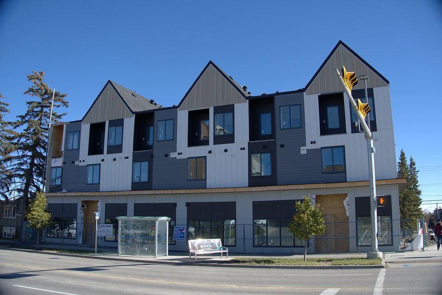 Mixed use corner, metal and panel cladding, Calgary